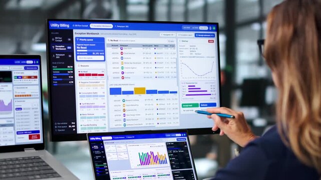 Utility Manager Reviews Billing Data On Laptop