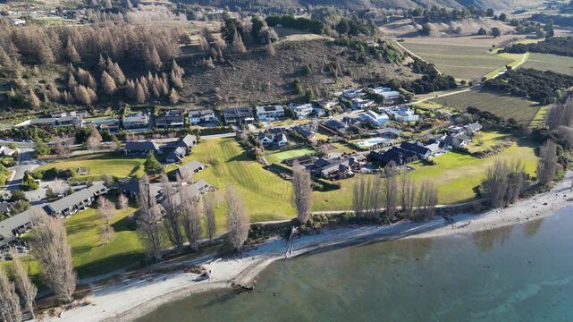 Wanaka Lake New Zealand aerial cityscape showcases beautiful Southern Alps mountain scenery with dramatic ranges and peaceful waterfront landscapes for travel and tourism