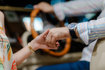 Close up shot of a loving couple hold hands inside a car during travel adventure, romantic moment capture for travel and lifestyle theme © photo for everything