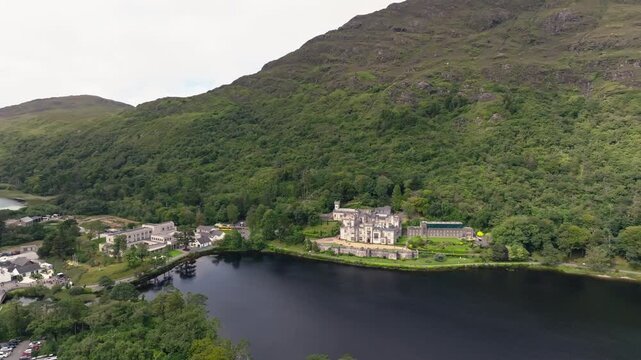Kylemore Abbey Letterfrack Ireland aerial view reveals Gothic architecture beside a beautiful lake surrounded by spectacular natural landscapes and European travel scenery