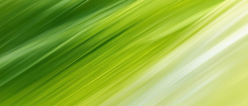 Abstract closeup of a green leaf surface with diagonal light streaks and soft blur
