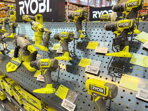 RYOBI brushless cordless drill displayed in hardware store.
