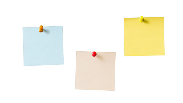Three colorful paper notes pinned on transparent surface for office notice boards.