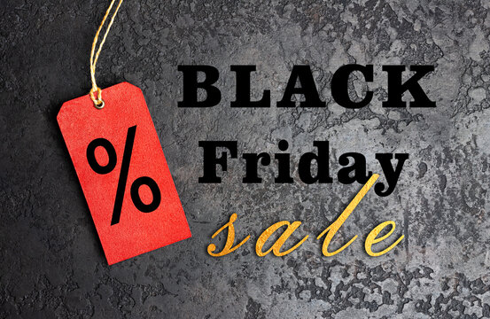 Black Friday sale text with red percentage tag on dark grunge background