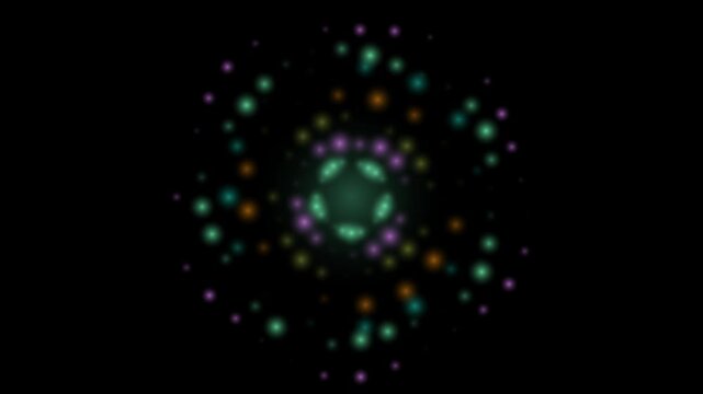 A looping video of glowing multicolored particles arranged in a circular mandala pattern on a black background.