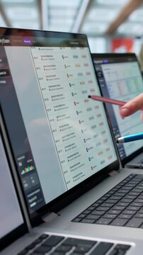 Regulatory Manager Reviews Compliance Dashboard During Client Exam Preparation
