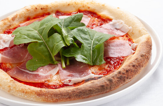 Prosciutto and wild arugula pizza