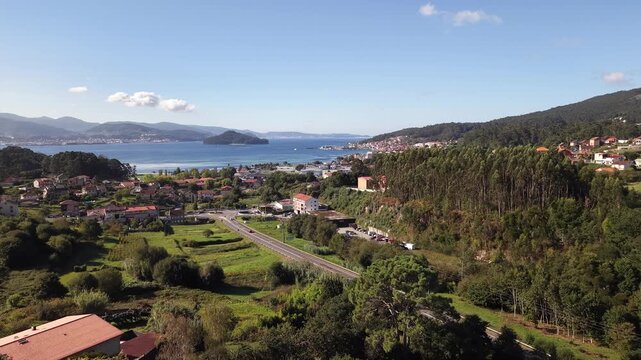 Historic poio monastery building standing among vineyards and green hills of galicia