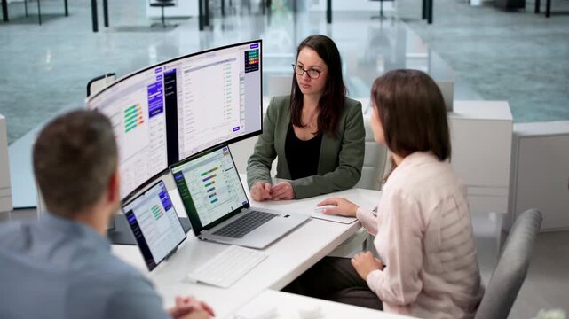 Insurance Agent Reviews Policy Endorsements With Diverse Team