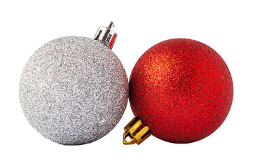 Fototapeta premium Two Christmas ornaments, one silver and one red, close together on a white background during the holiday season
