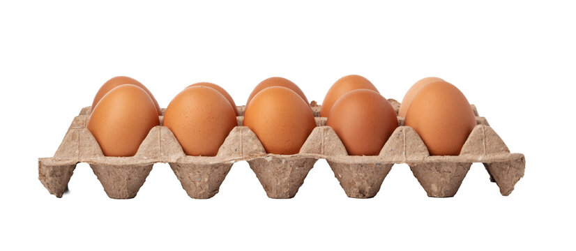 Brown eggs in a carton sitting on a plain surface