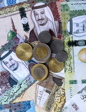 Saudi riyal money notes and coins on table. Saudi Arabia cash bills of SAR currency close up
