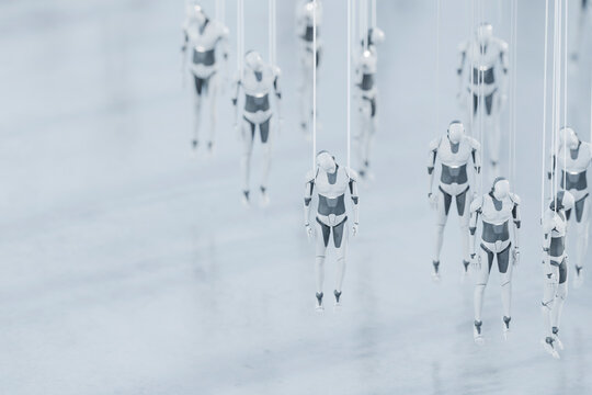 Group of suspended robots awaiting activation in minimal futuristic manufacturing facility, 3D rendering