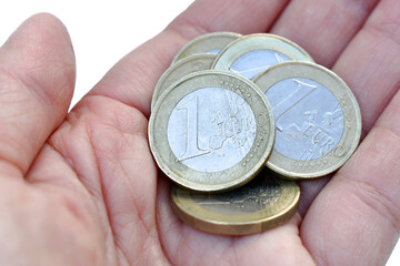 1 Euro coins in hand. Woman hand holding 5 Euro money. Saving for future concept.