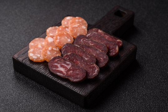 Sliced dry cured beef sausage or basturma with salt and spices. Sliced basturma