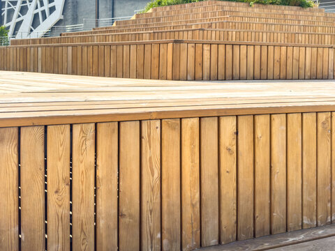 Weathered wooden deck with vertical boards and fenced terrace exterior