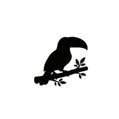 Fototapeta premium Black silhouette of a toucan bird perched on a tree branch