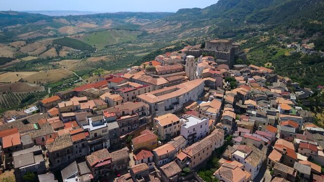 Santa Severina Calabria Italy Hilltop Village Medieval Castle Drone Orbit Sideways Flyby Green Valleys Olive Groves Italian Borgo Establishing B Roll 4K Most beautiful villages