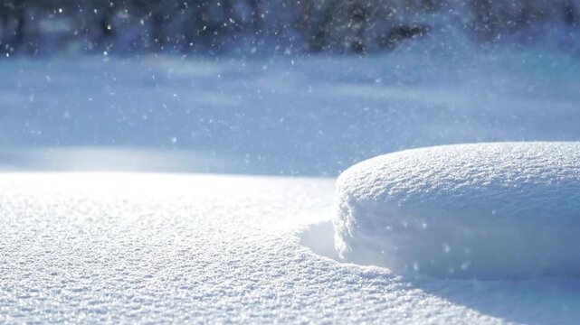Sparkling snow covered podium with gentle blowing winter wind and falling flakes showcasing blank empty display surface for product presentation in serene cold weather motion video clip