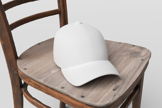 White cap mockup on wooden chair isolated on light gray background, blank snapback hat template for apparel headwear streetwear branding presentation, 3d render