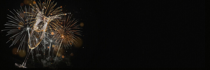 New Year banner with splashing champagne glass, golden and silver fireworks, smoke and golden bokeh on black night background with large empty copy space for text and greetings © ale studio 