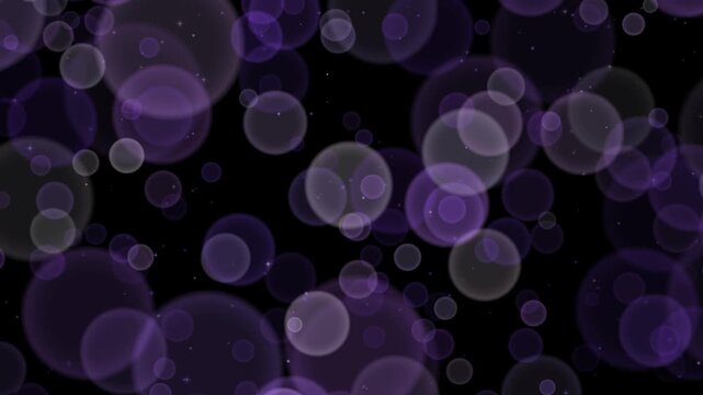 Violet purple bokeh lights drifting across a black background as large defocused circles overlap in layers of depth with sharp twinkling sparkles scattered between them