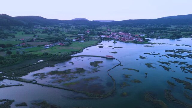Aerial drone view of the marshes in Escalante in the Marismas de Santo&ntilde;a, Victoria y Joyel Natural Park. Cantabrian Sea. Santo&ntilde;a, Cantabria, Spain, Europe