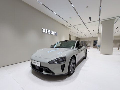 Shenzhen, China - September 21, 2026: Xiaomi SU7 sedan in Xiaomi Auto showroom wide angle