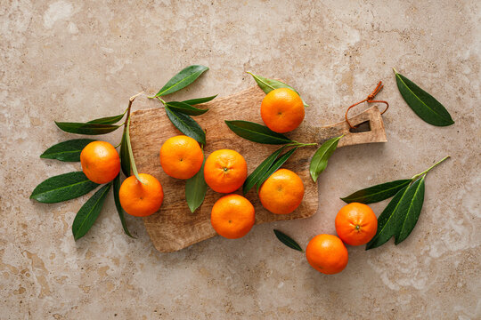 Mandarins fresh citrus fruit with green leaves