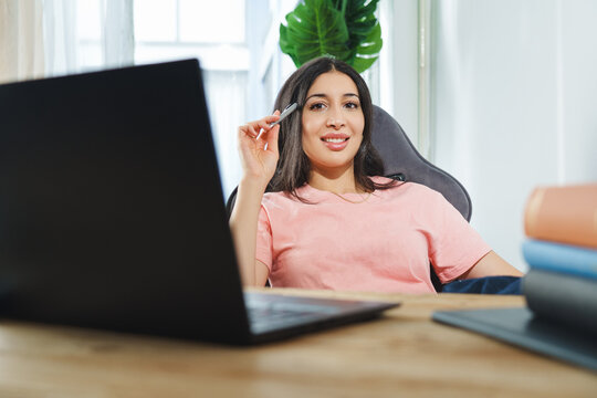 Cropped portrait of an attractive young businesswoman working on her laptop while sitting in the office.