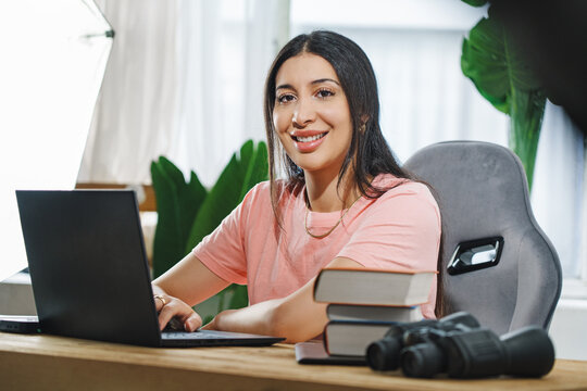 Cropped portrait of an attractive young businesswoman working on her laptop while sitting in the office.