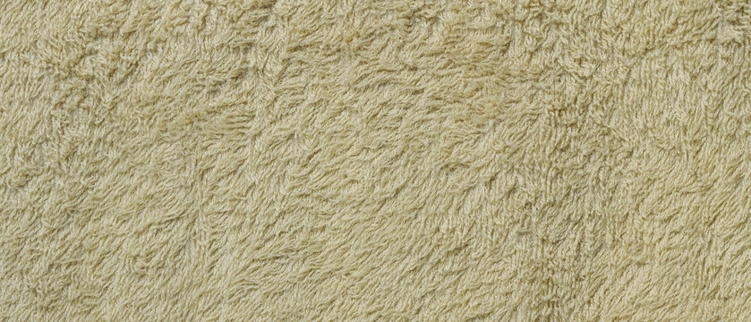 Cream colored plush fabric with irregular long pile and a soft tactile texture background