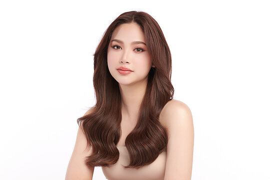 A beautiful young Asian woman with clean, fresh skin against a white background. Skincare, facial treatment, cosmetology, beauty, and spa. An elegant portrait of an Asian woman.