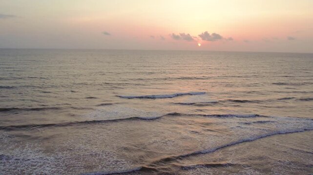 Aerial view of arambol beach in goa india during a peaceful sunset
