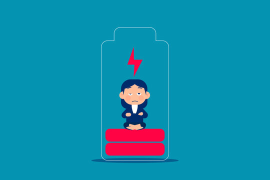Loss. Businesswoman meditating inside the battery to charge.