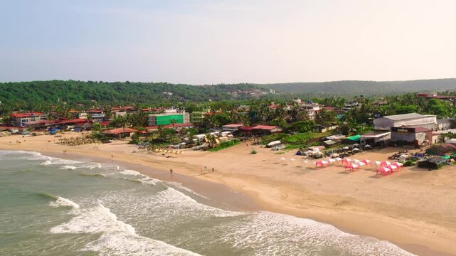 Aerial view of baga beach in goa india with tropical coastline and