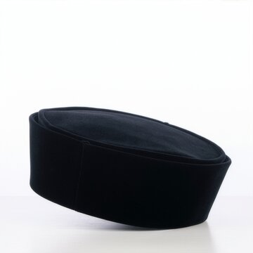 Black velvet peci cap isolated on white background