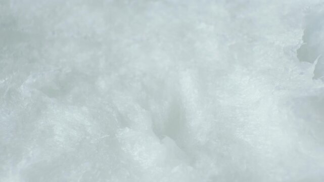 Abstract culinary background with rotating coconut butter texture.