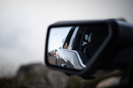 Rear View Mirror Reflection Roadside Scene
