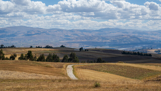 Huancayo, Jun&iacute;n, Per&uacute; : A winding rural road crosses harvested fields in the high Andes near Huancayo. Seen on the route toward Cruz de la Paz above Huancayo, Peru.