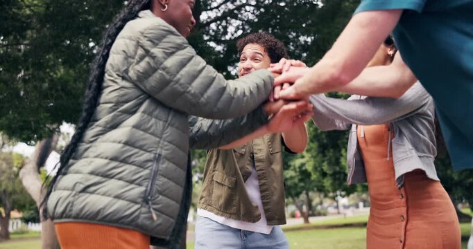 Happy, man and friends with stack at park for social inclusion, solidarity and shared success. Applause, people and pile with celebration for friendship achievement, belonging huddle and group spirit