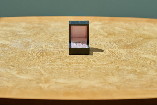 Close Up Of Two Wedding Rings In Box On Table At Registry Office Ceremony