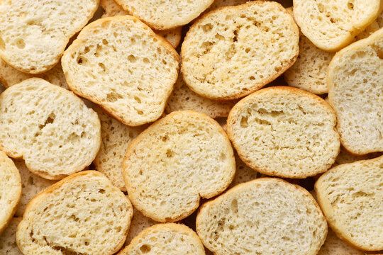 Round bread croutons background. Top view