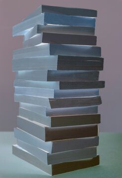 Pile of balancing paperbook books, abstract view,