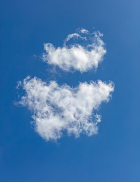 Cumulous clouds, white fluffy clouds in a blue sky.