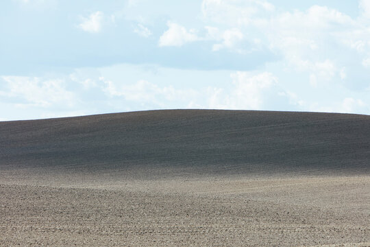 The Palouse, a large fertile agricultural prairie region, bare soil, tilled farmland.