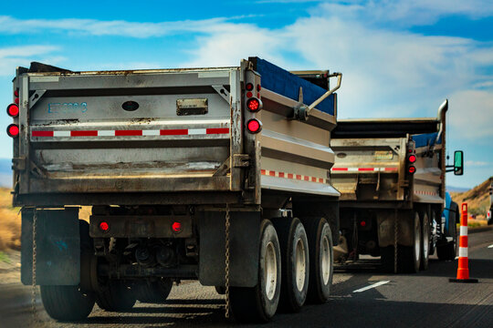 Highway construction along Interstate 90 from Vantage to George, two lorries on the road, dumper trucks.