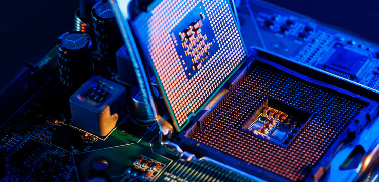 Banner of cpu socket and microprocessor on motherboard for technology wide background banner with neon blue lighting