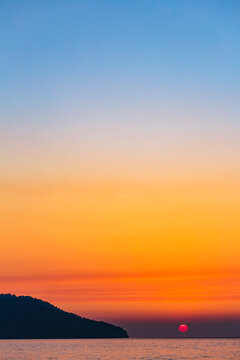 Widfire smoke influenced sun sunset on the Strait of Juan de Fuca, Port Angeles