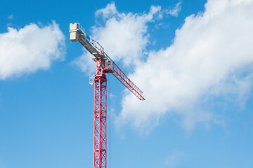 Red Tower Crane Against Blue Sky with Copy Space © Анатолий Еремин